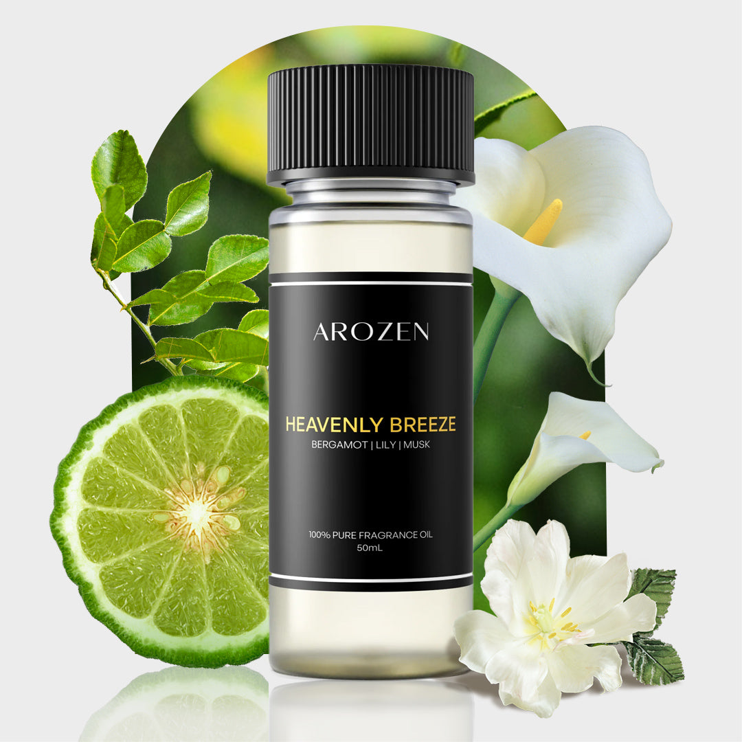 
                  
                    A bottle of Arozen HEAVENLY BREEZE Fragrance Oil is displayed before bergamot, lilies, and jasmine on a light background, with its label featuring bergamot, lily, and musk notes.
                  
                